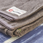 Couverture pliable en laine recyclées sédiment Manduka